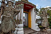 Bangkok Wat Pho, door guardians of the monumental gates of the outer walls of the temple compund. 